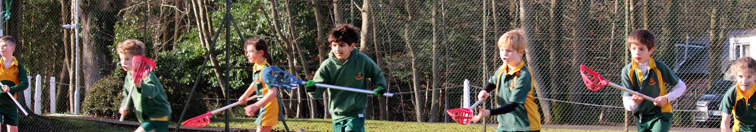 School Children Playing Lacross