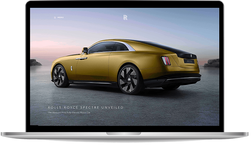 Laptop with Roll-Royce Spectre website showing on the screen.